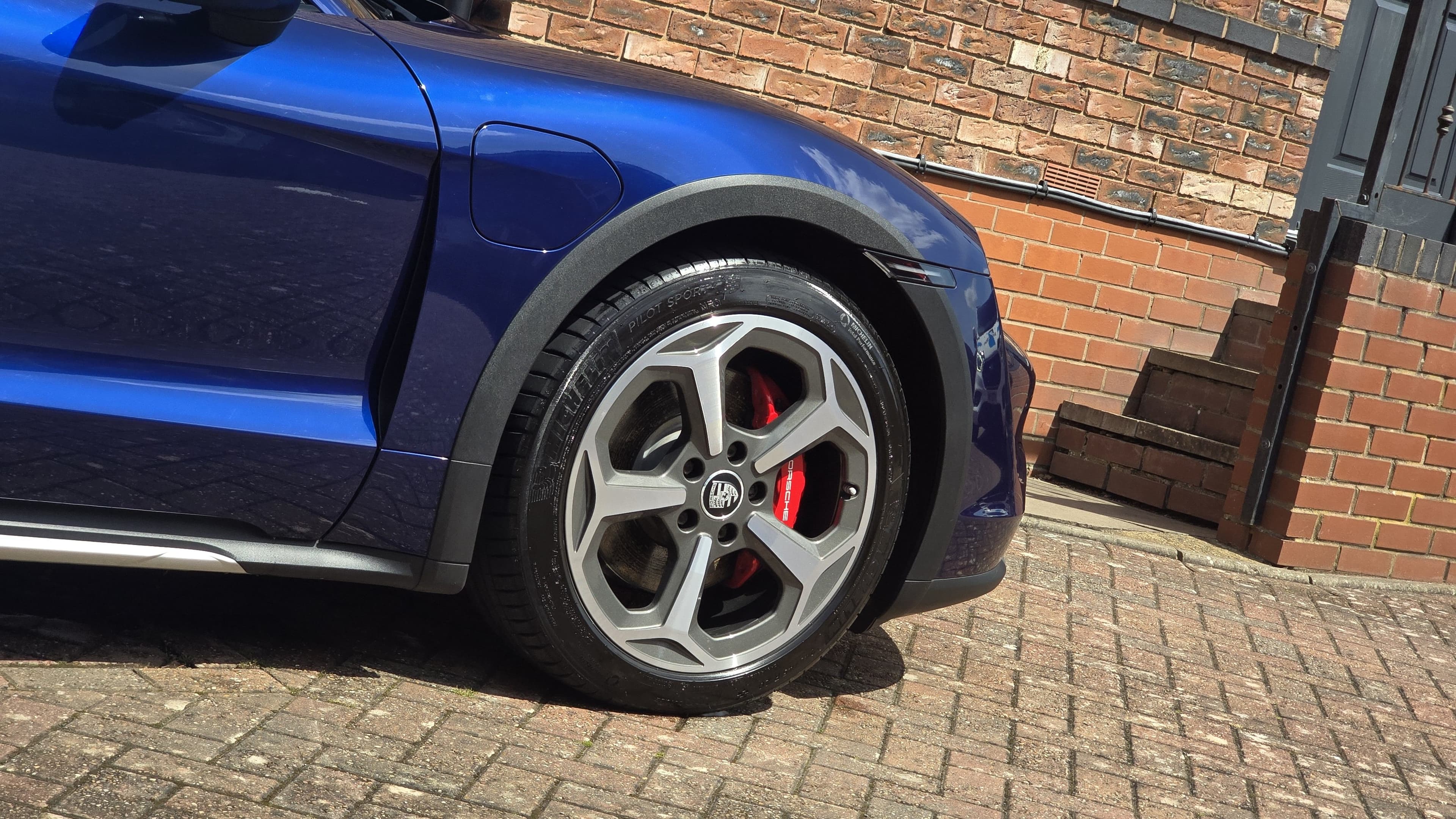 Clean alloy wheel and red brake caliper detail after Blue Horizon Detailing service, Warwickshire