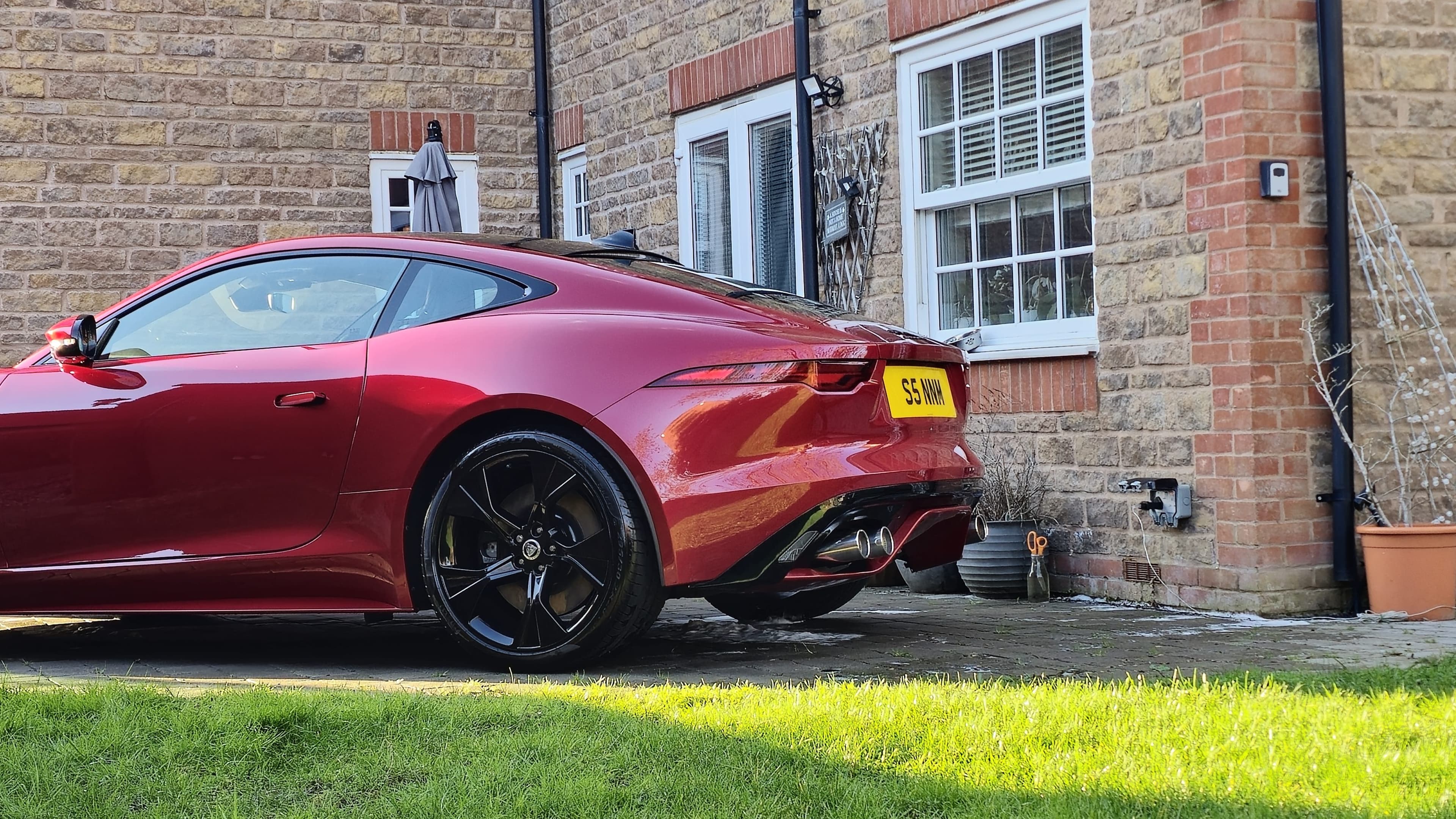 Red Jaguar F-Type showing stunning gloss paint finish after car detailing by Blue Horizon Detailing — paint correction Warwickshire