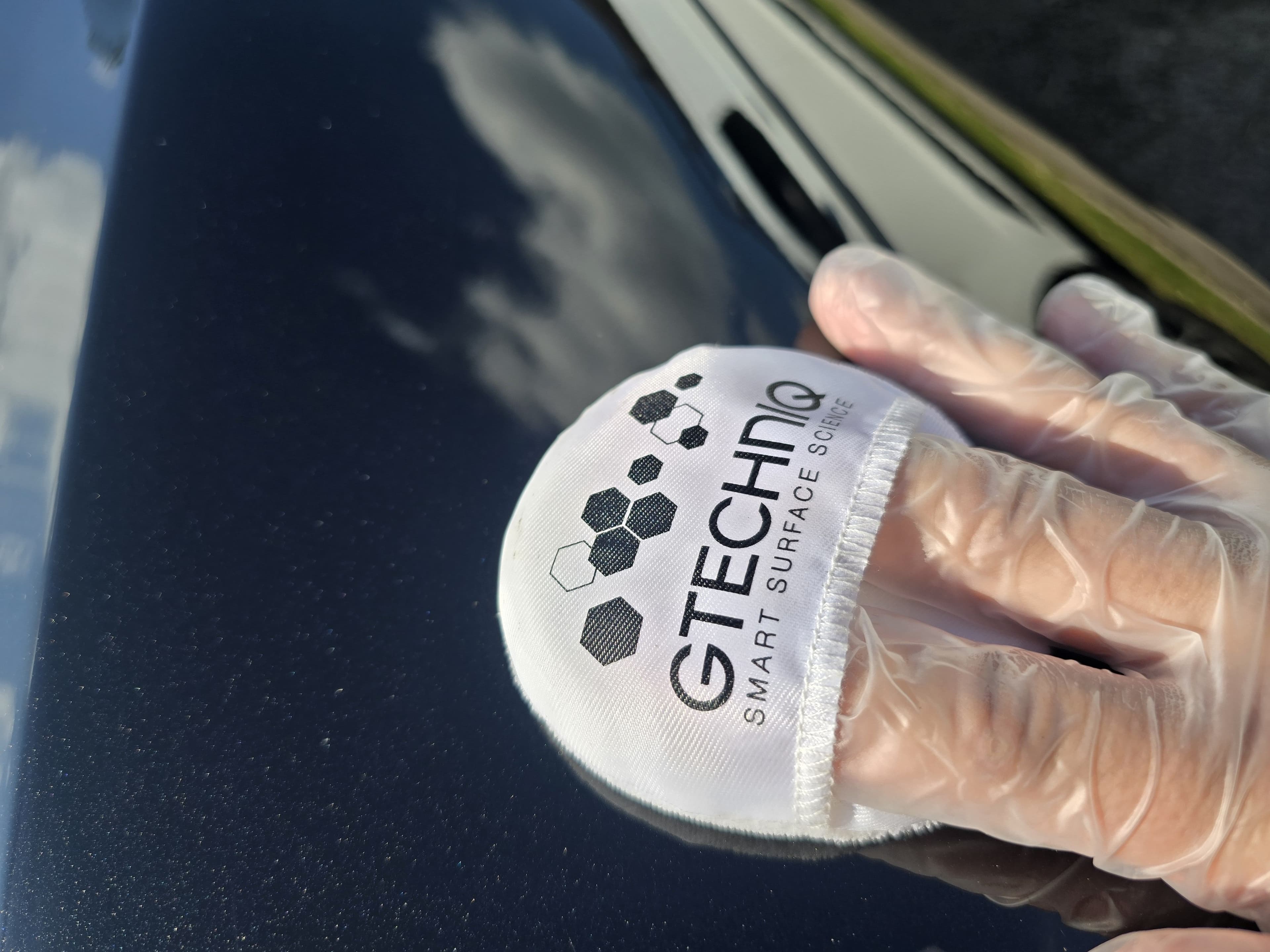 Professional GTechniq ceramic coating application in progress on vehicle paintwork — mobile service by Blue Horizon Detailing, Warwickshire