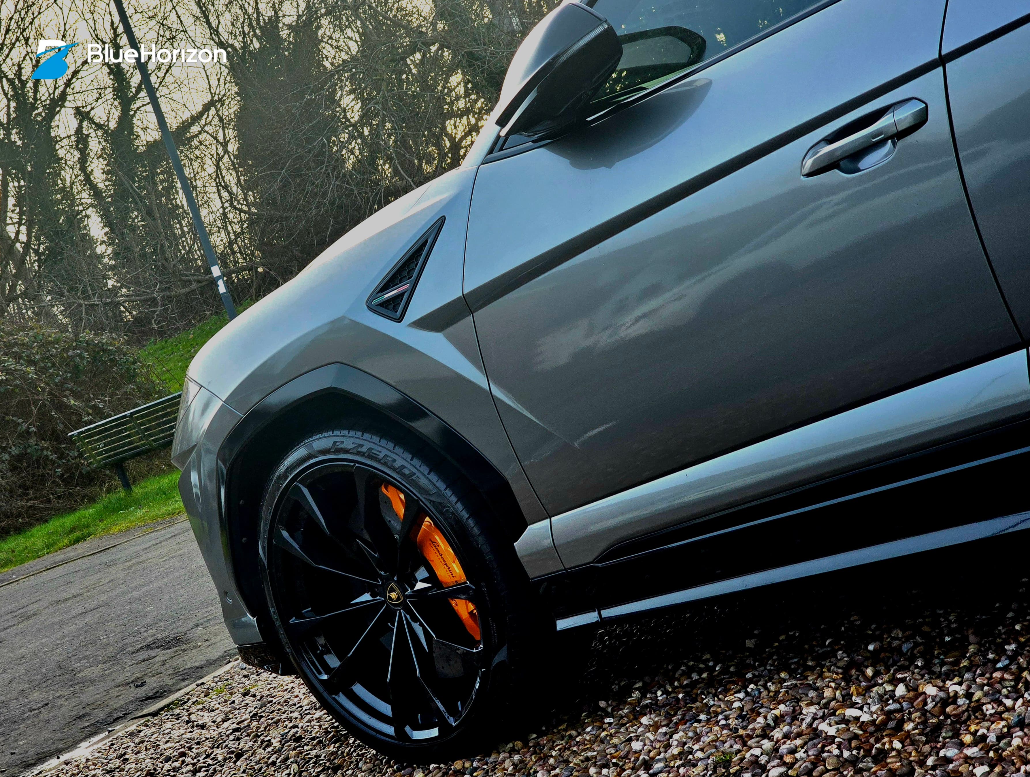 Lamborghini Urus side profile showing deep ceramic-coated paint gloss — mobile detailing by Blue Horizon Detailing, Warwickshire