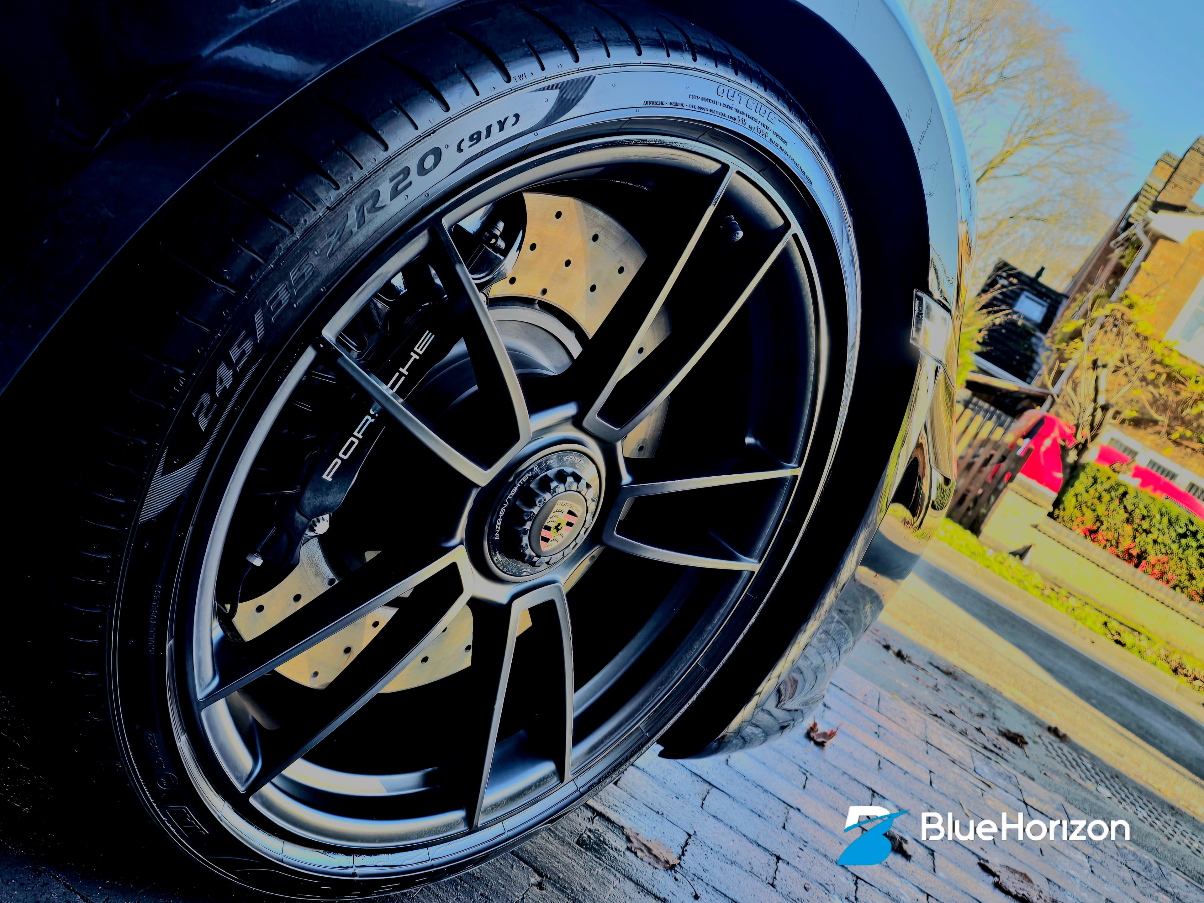 Porsche 911 GTS black alloy wheel with gold brake caliper after valet by Blue Horizon Detailing — caliper painting Warwickshire