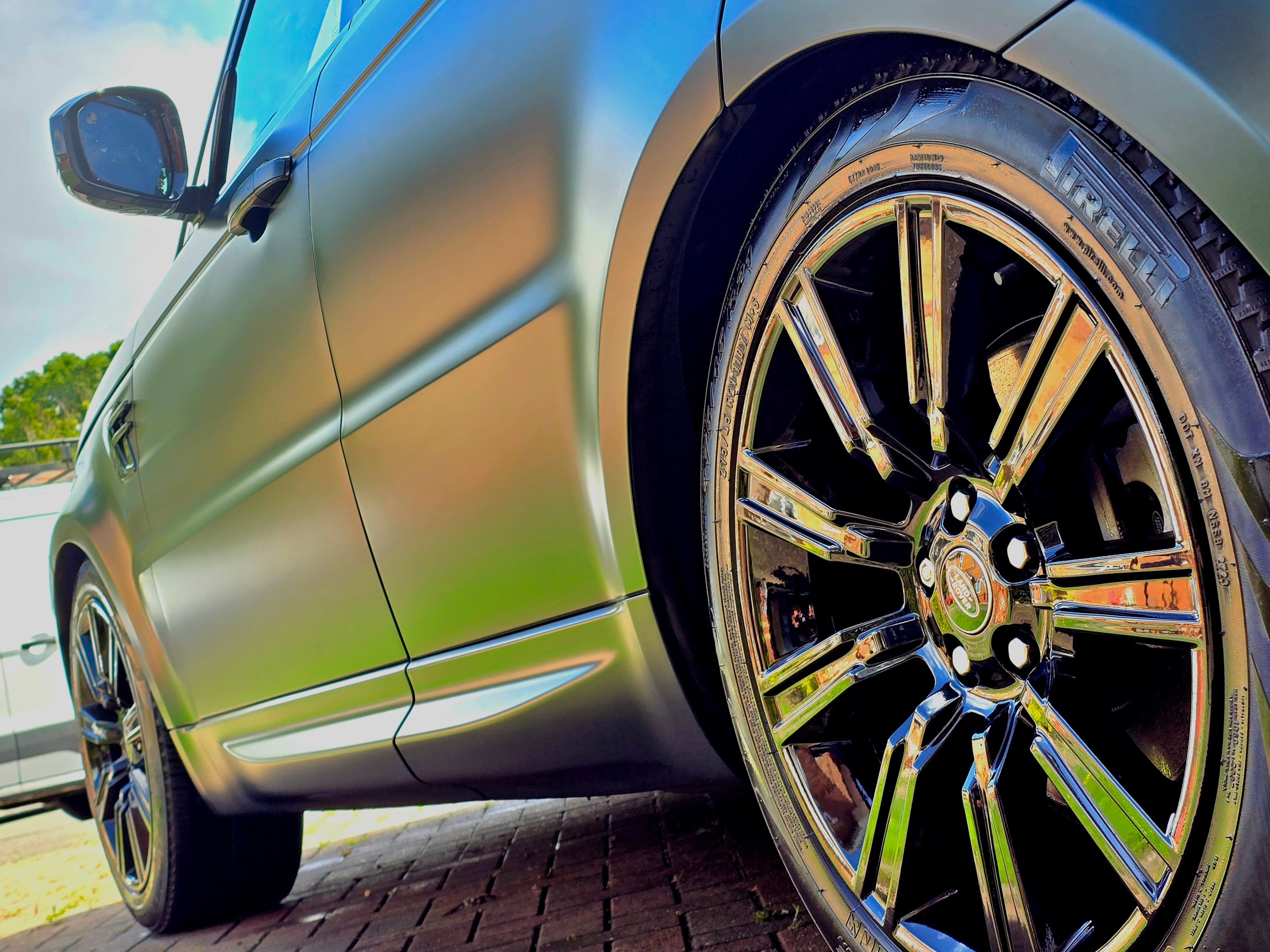 Range Rover Sport matte paint close-up showing alloy wheel after safe matte-compatible treatment, Warwickshire