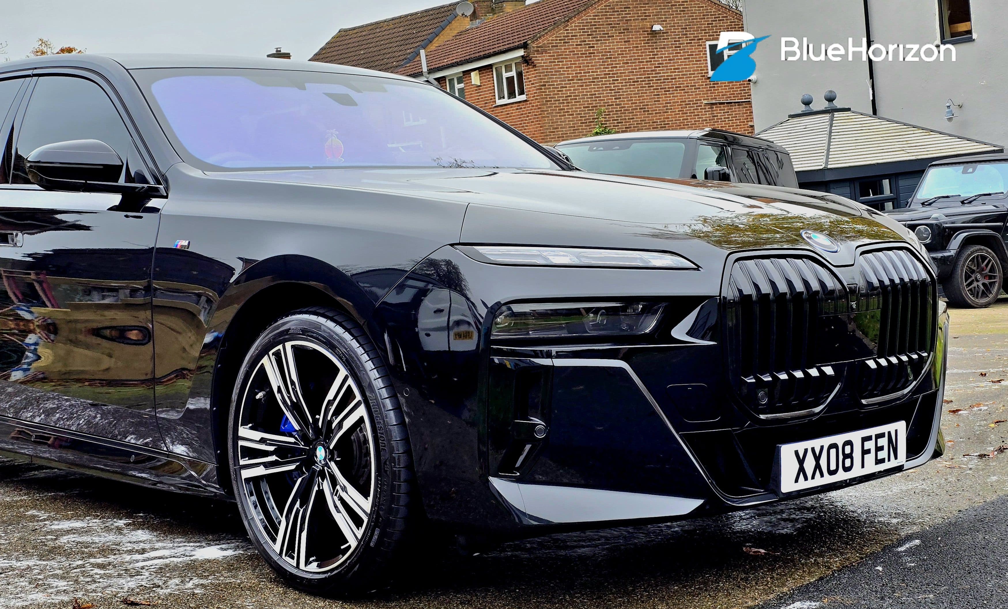 Black BMW 7 Series showing deep gloss paint after professional detailing by Blue Horizon Detailing — premium maintenance plan Warwickshire