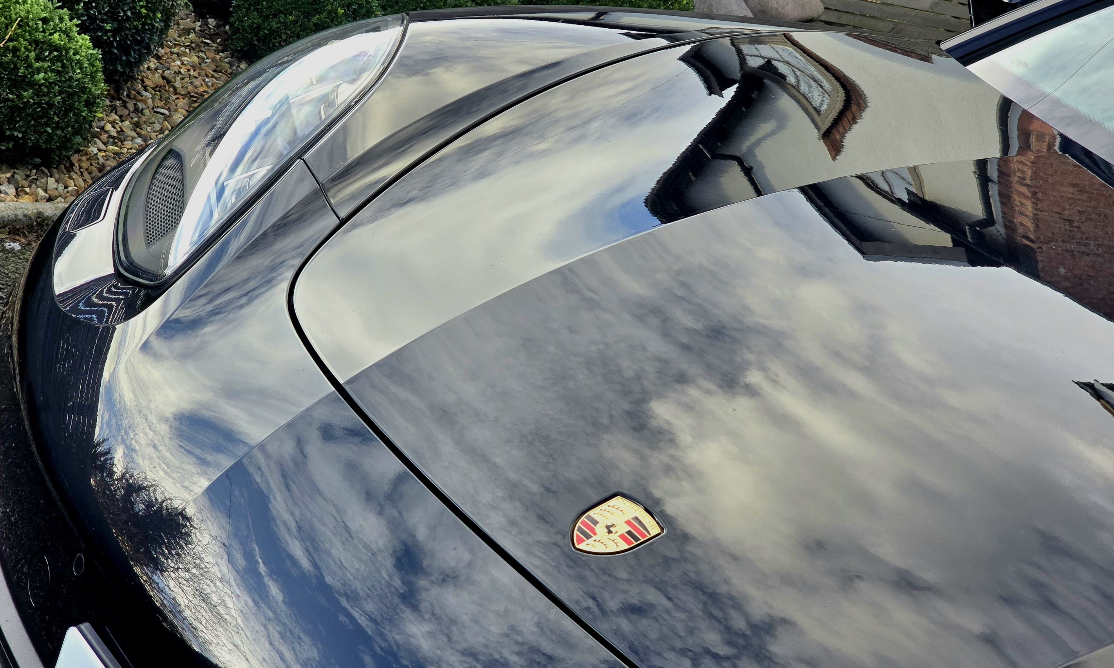 Sky reflections in a Porsche bonnet after paint correction