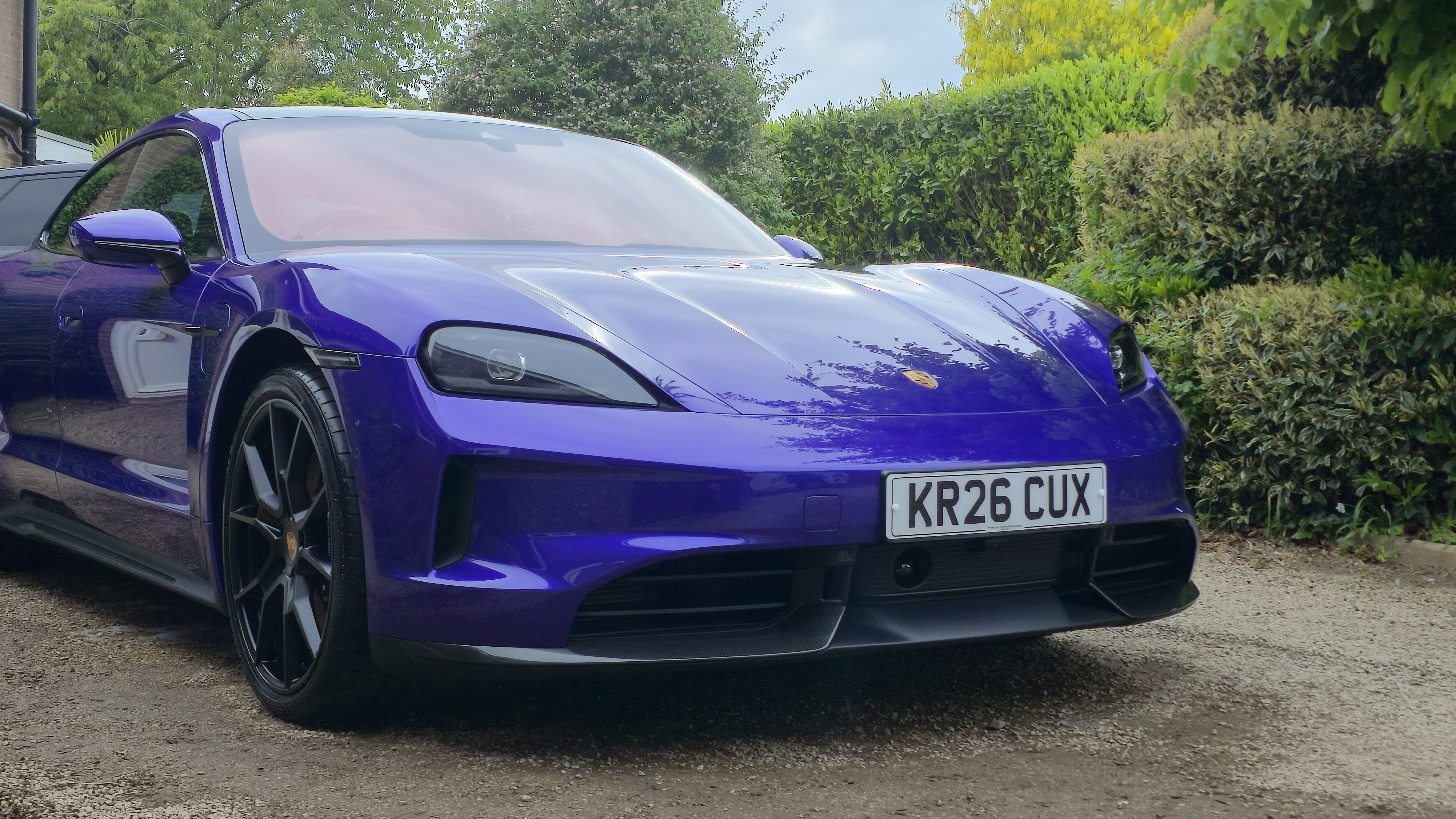Porsche Taycan GTS Ultraviolet Purple exterior side view showing ceramic coating gloss depth, Warwickshire