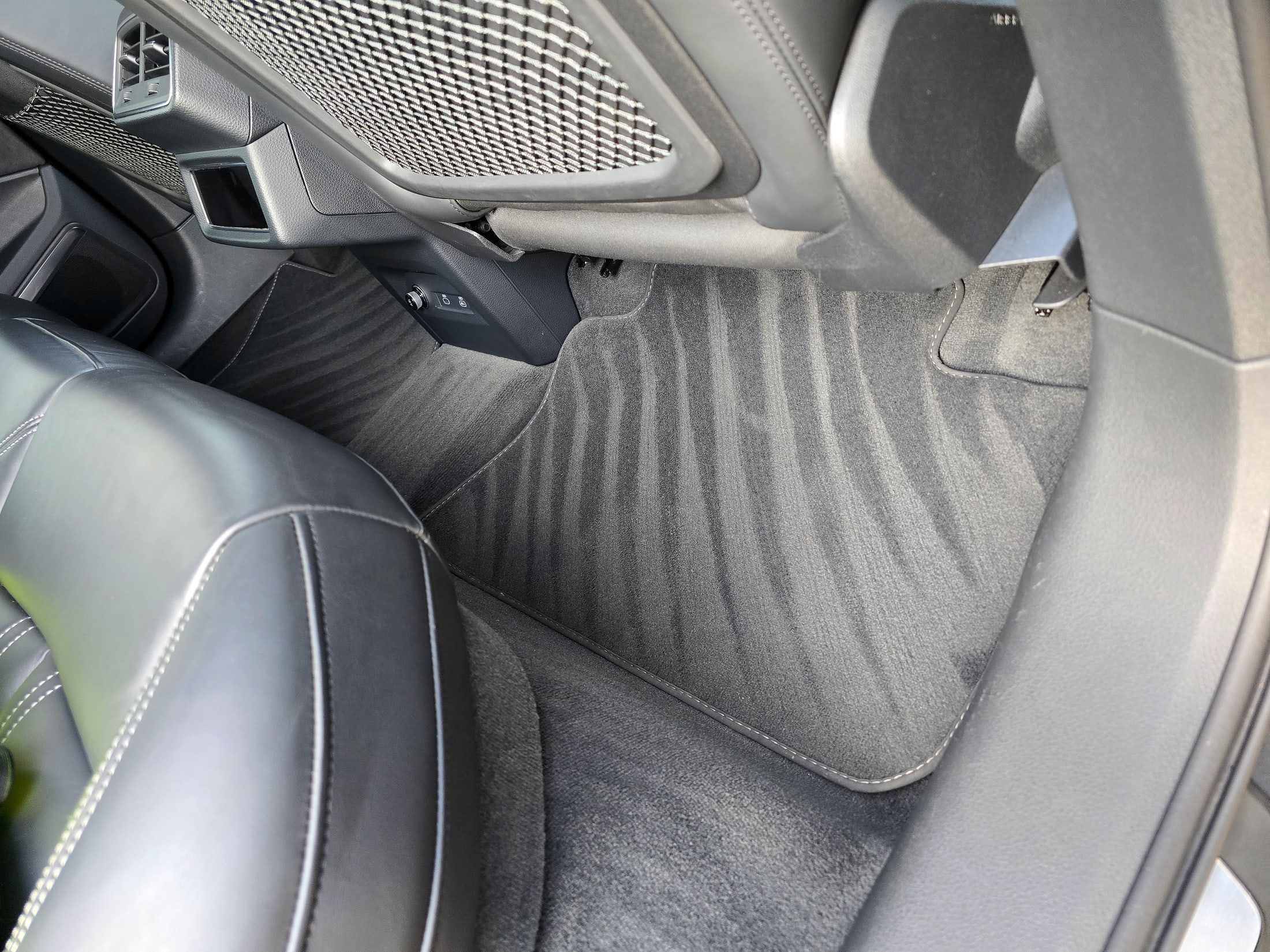 Spotless Audi Q8 e-tron driver footwell and mat with fresh vacuum lines