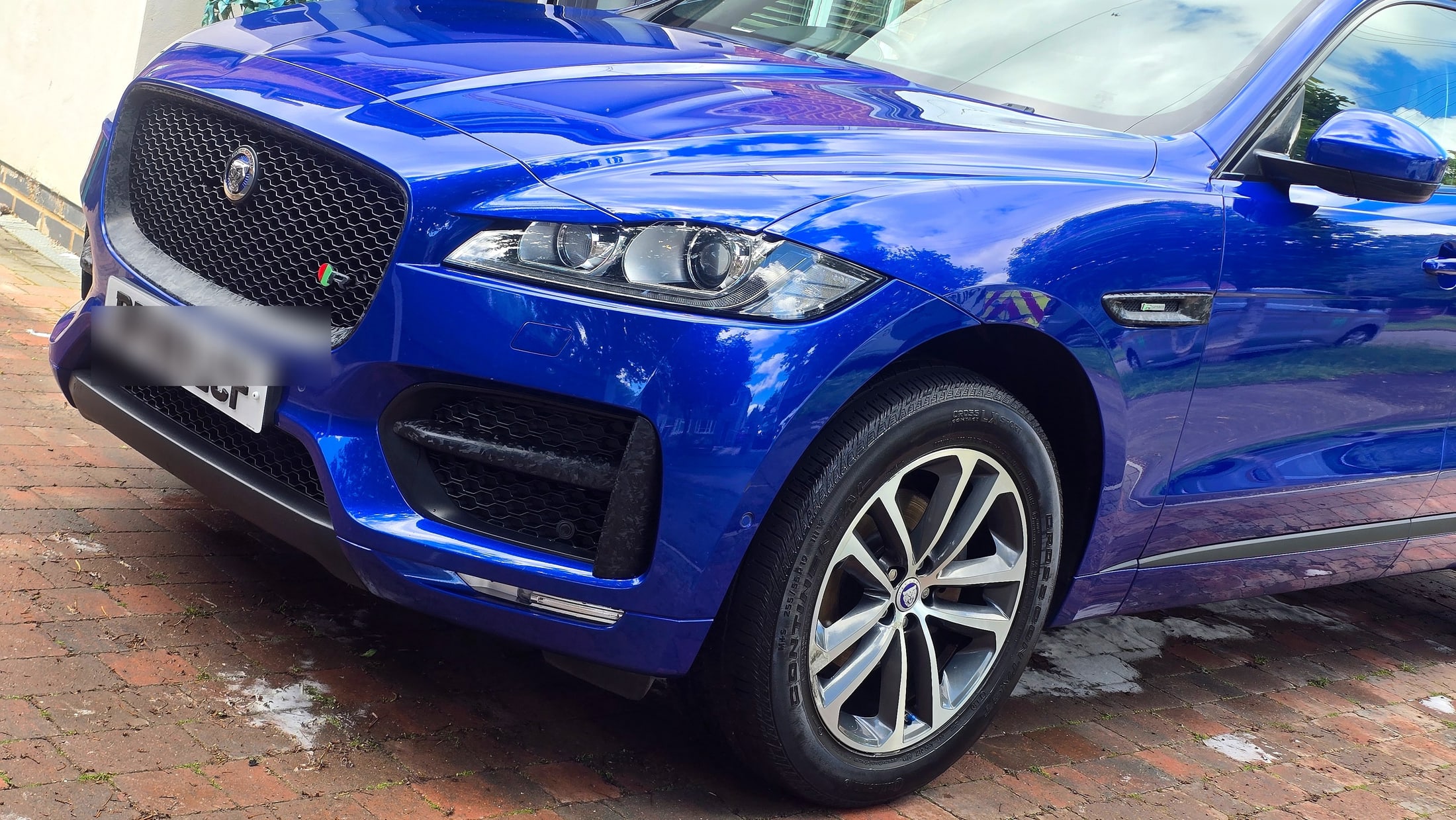 Jaguar F-Pace front three-quarter, deep gloss blue paint after tree sap removal in Rugby